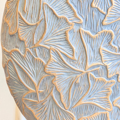 Close detail of Folia raised ginkgo leaf texture with gold edging on grey resin