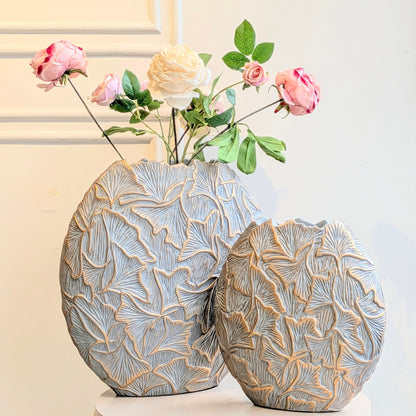 Folia large and small grey and gold ginkgo leaf resin vases shown together