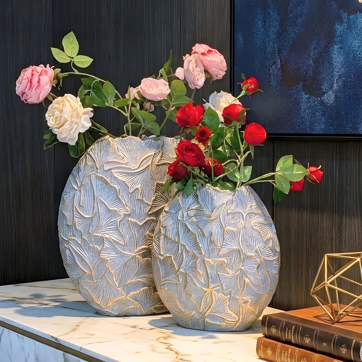 Folia sculptural grey and gold ginkgo leaf vases styled on a dark sideboard