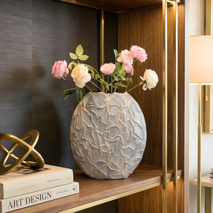 Folia large sculptural ginkgo leaf resin vase styled on a display shelf