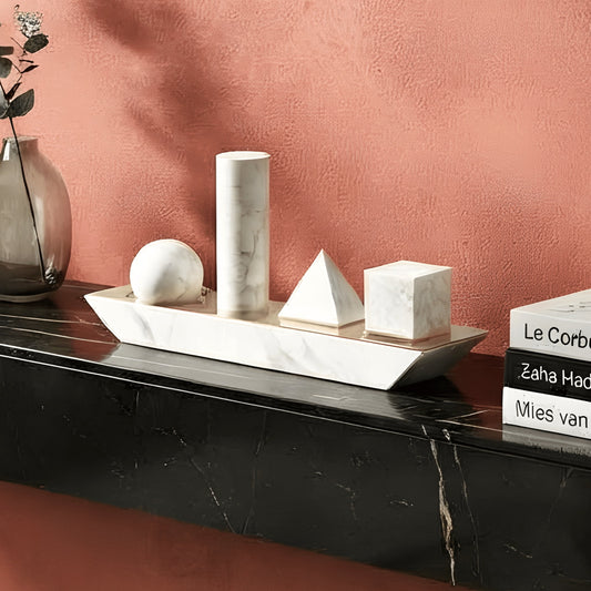 Geometry white marble geometric showpiece styled on a black console table