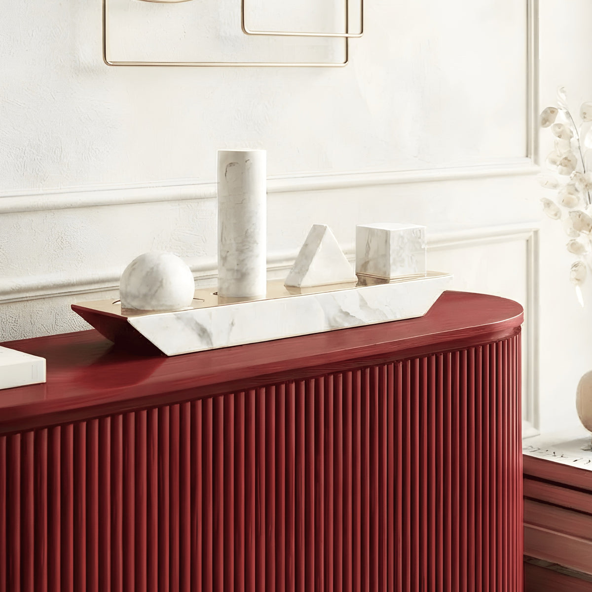 Geometry white marble geometric showpiece styled on a red living room sideboard