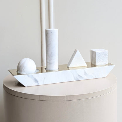 Geometry marble showpiece featuring sphere cylinder pyramid and cube forms