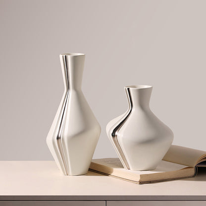 Grace ceramic table vases styled with an open book on a sideboard