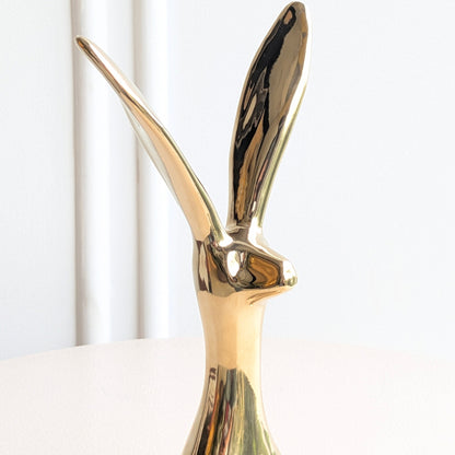 Large Hareloom gold ceramic rabbit figurine with elongated upright ears and reflective glaze