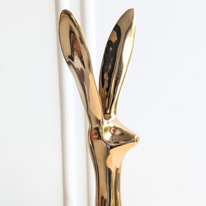 Large gold glazed ceramic rabbit showpiece with contemporary elongated silhouette