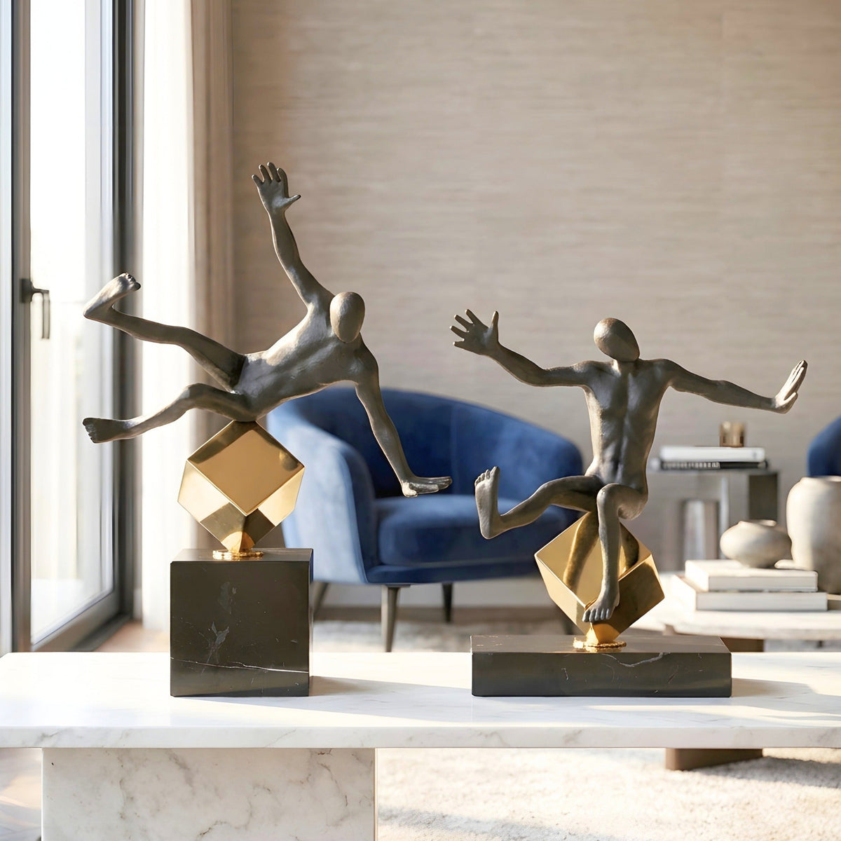 Kinesis metal human figurines styled on a living room console