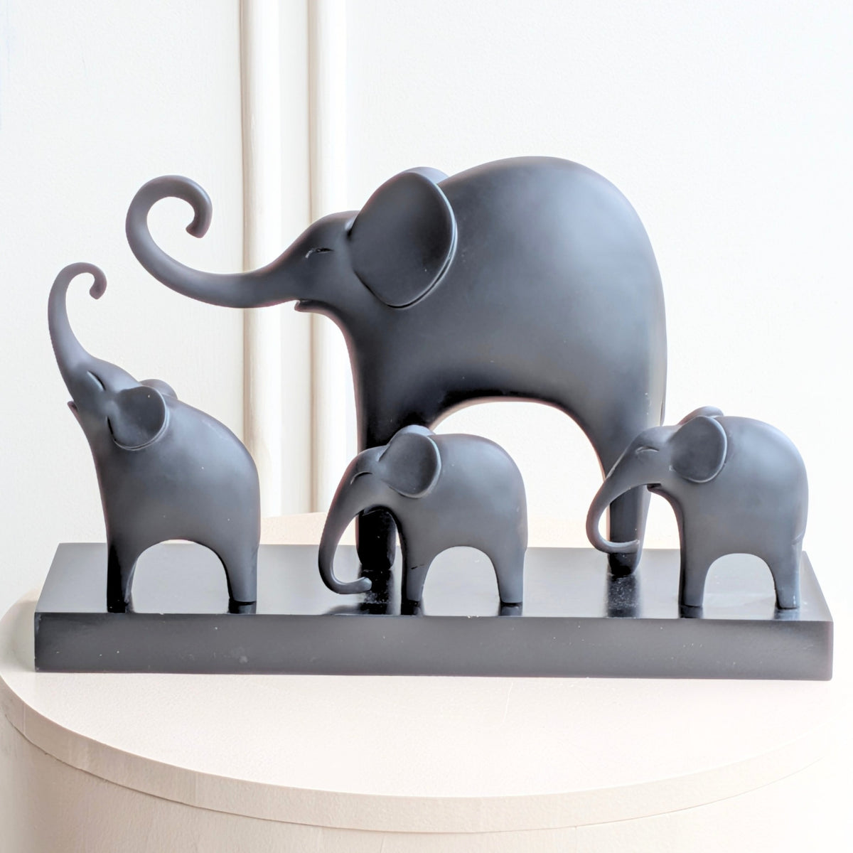 Kinship black resin elephant family showpiece with four elephants on a rectangular base for luxury console styling, view 5