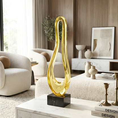 Loop tall gold abstract showpiece styled on a marble center table in a modern living room