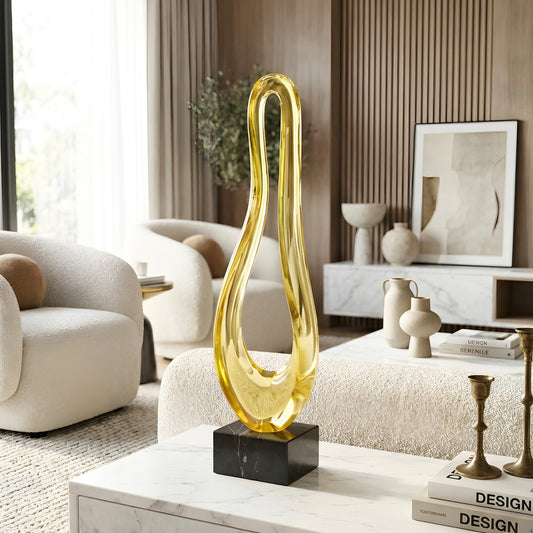 Loop tall gold abstract showpiece styled on a marble center table in a modern living room