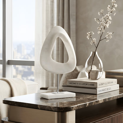 Loop luxury sandstone resin and marble abstract showpiece styled on a coffee table