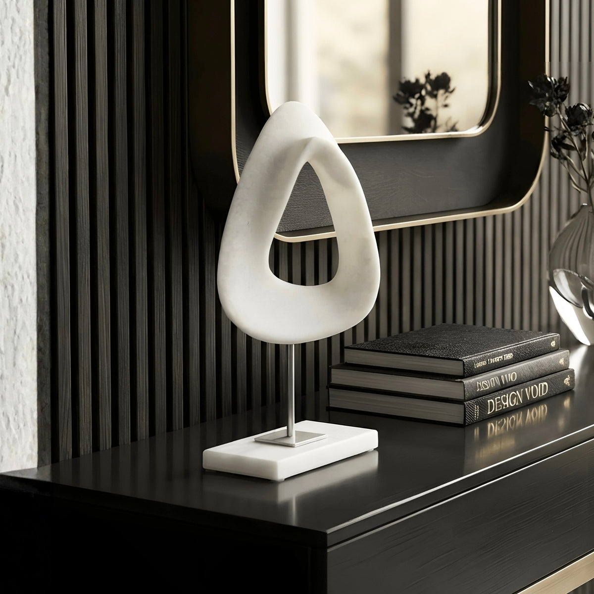 Loop white abstract sculpture styled on a luxury black console table