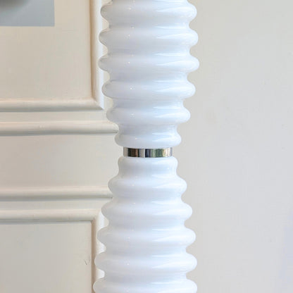 Close-up of ribbed white glass and stainless steel detailing on Luma Totem floor lamp