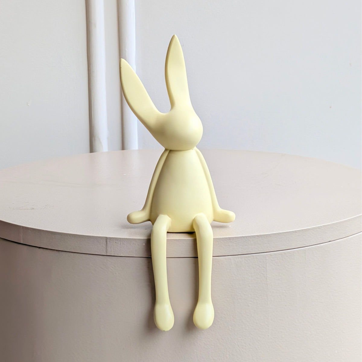 Meadow beige resin rabbit showpiece with long ears and dangling legs