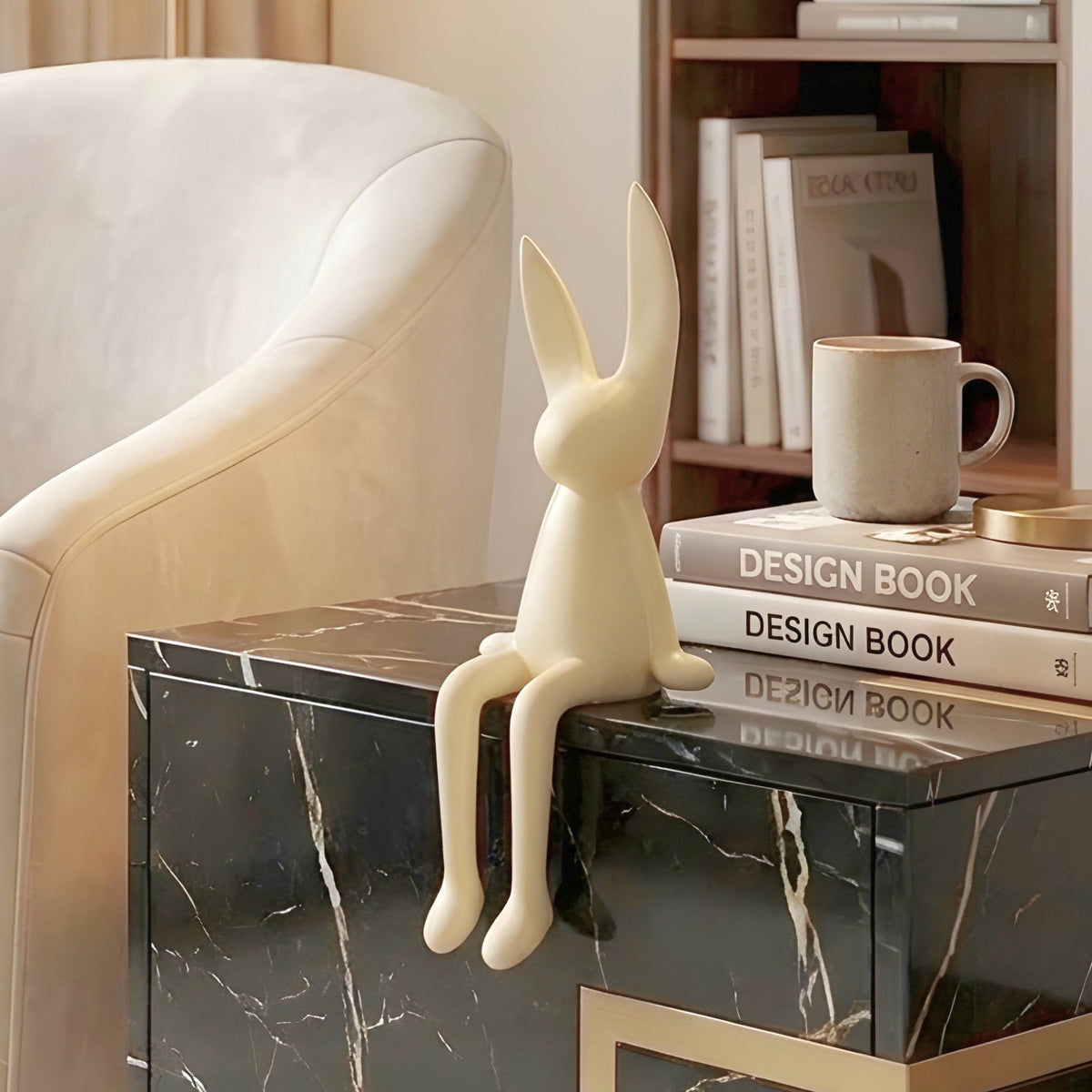 Meadow beige rabbit showpiece styled on a side table beside a reading chair