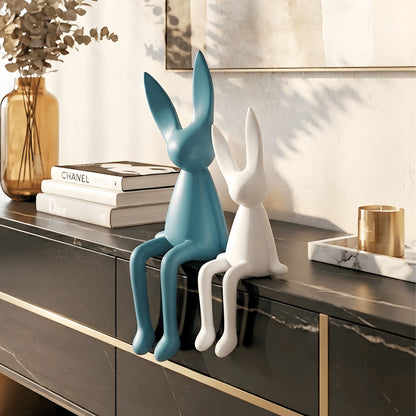 Meadow blue and white rabbit showpieces styled on a modern console table