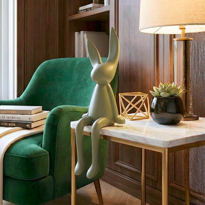 Meadow olive green rabbit showpiece styled in a modern reading corner