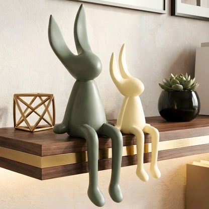Meadow olive green and beige rabbit showpieces styled on a console table