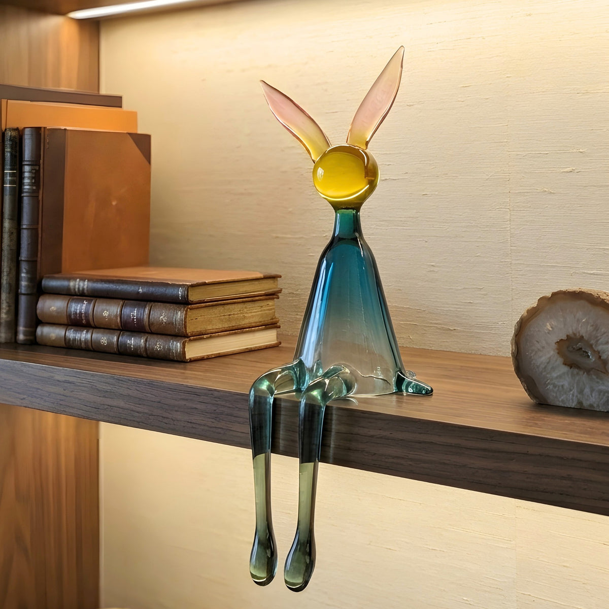 Moxie colourful resin rabbit showpiece styled on a bookshelf