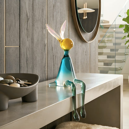 Moxie playful seated rabbit showpiece on a contemporary foyer console