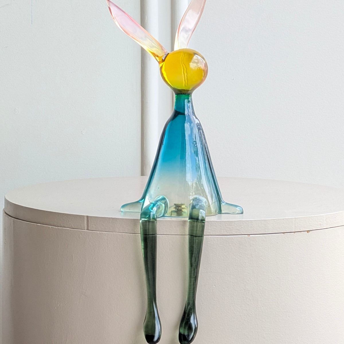 Moxie colourful bunny figurine front angle with blue body and dangling legs