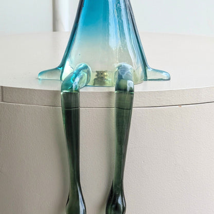 Close-up of Moxie translucent resin rabbit seated with hanging legs