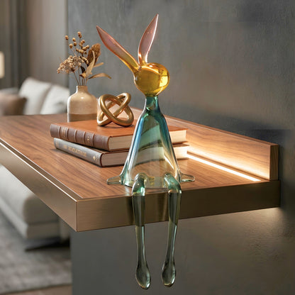 Moxie translucent rabbit resin figurine styled on a wooden sideboard with books