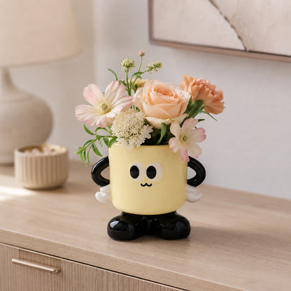 Mugsy ceramic organizer styled as a flower vase on a sideboard
