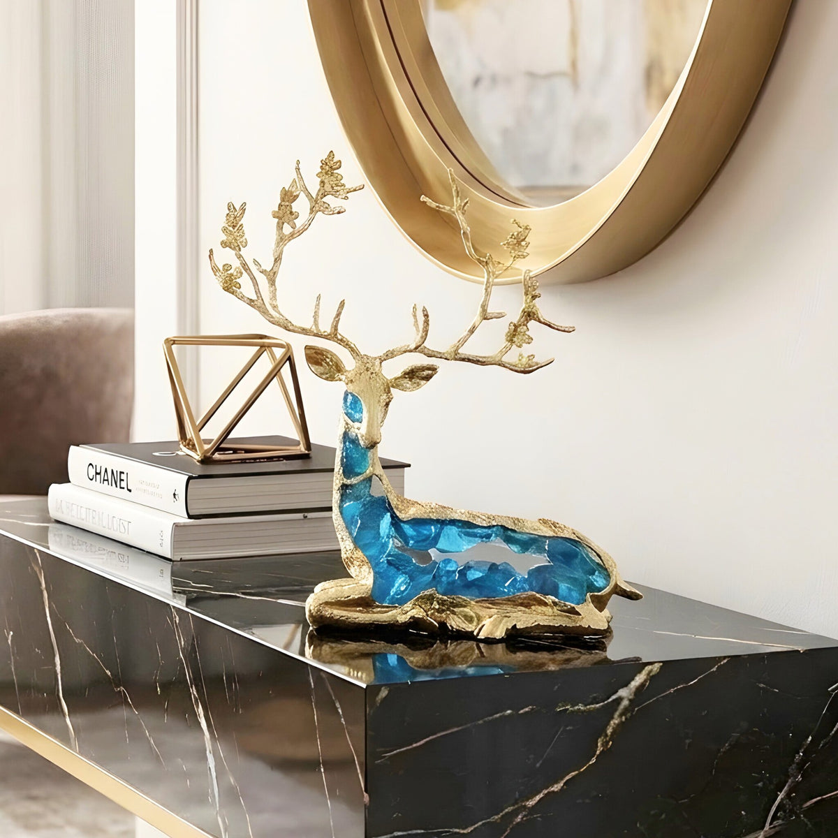 Mystique sitting blue deer showpiece styled on a black marble console table