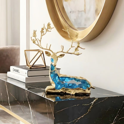 Mystique sitting blue deer showpiece styled on a black marble console table