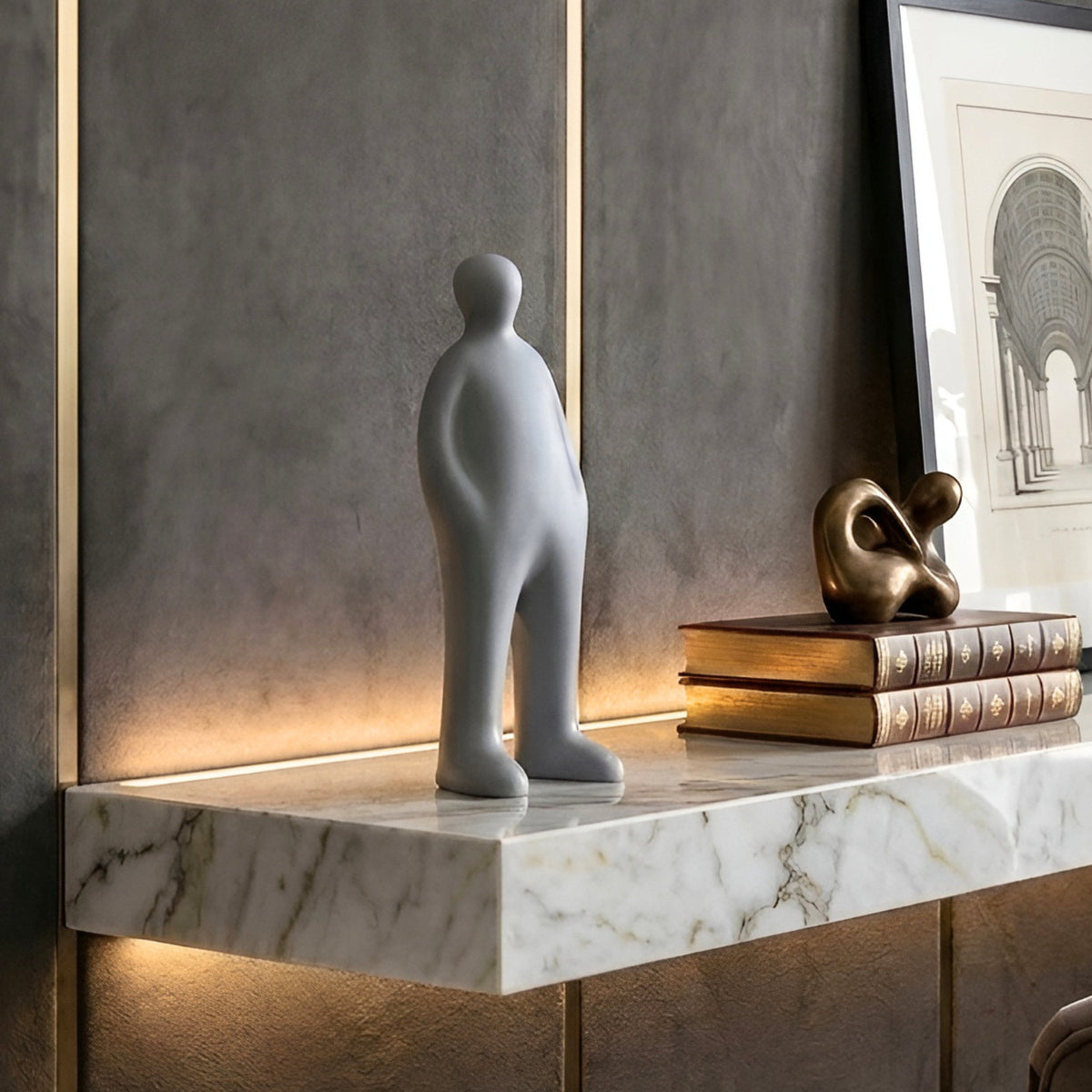 Off Duty Grey human figure sculpture in a contemporary living room