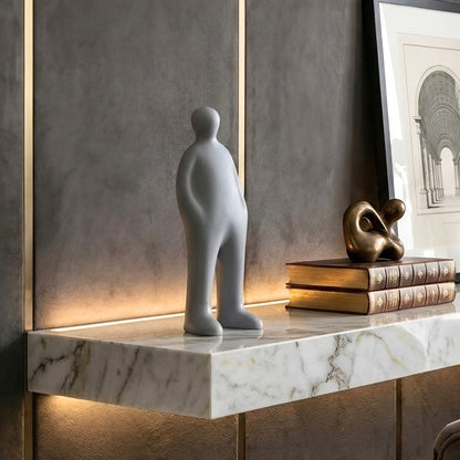 Off Duty Grey human figure sculpture in a contemporary living room