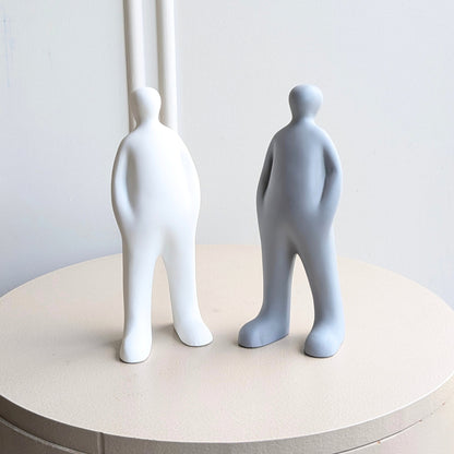 Off Duty minimalist resin standing figurines in White and Grey shown together