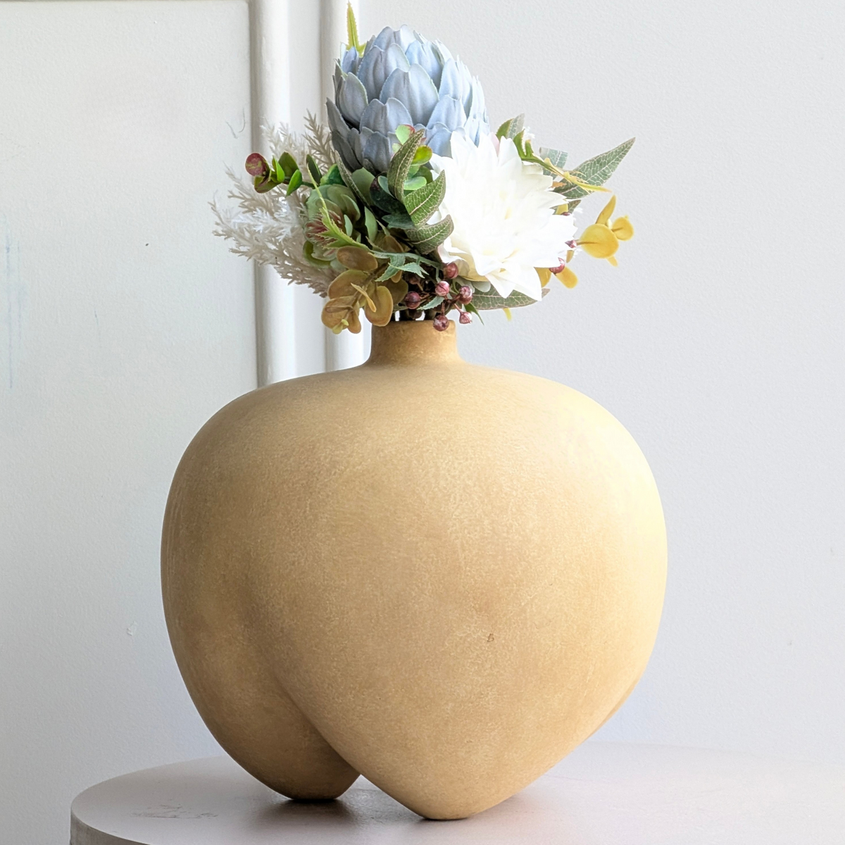 Ovelle warm sand ceramic vase rounded sculptural form and textured finish detail