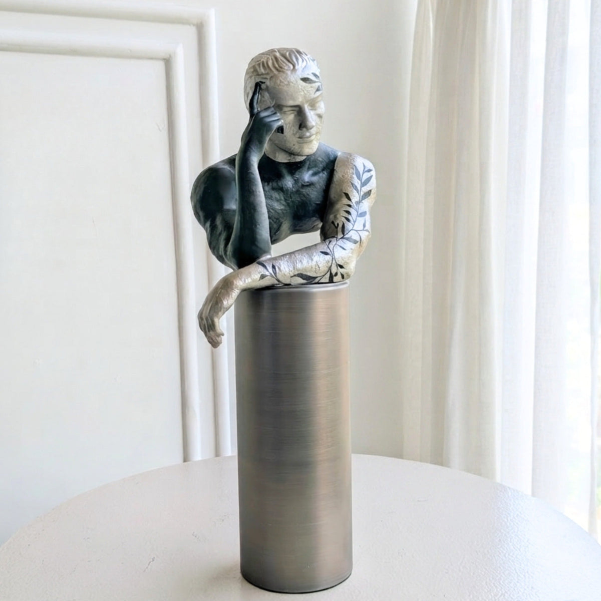Front view of the Pensive metal and resin thinking man figurine