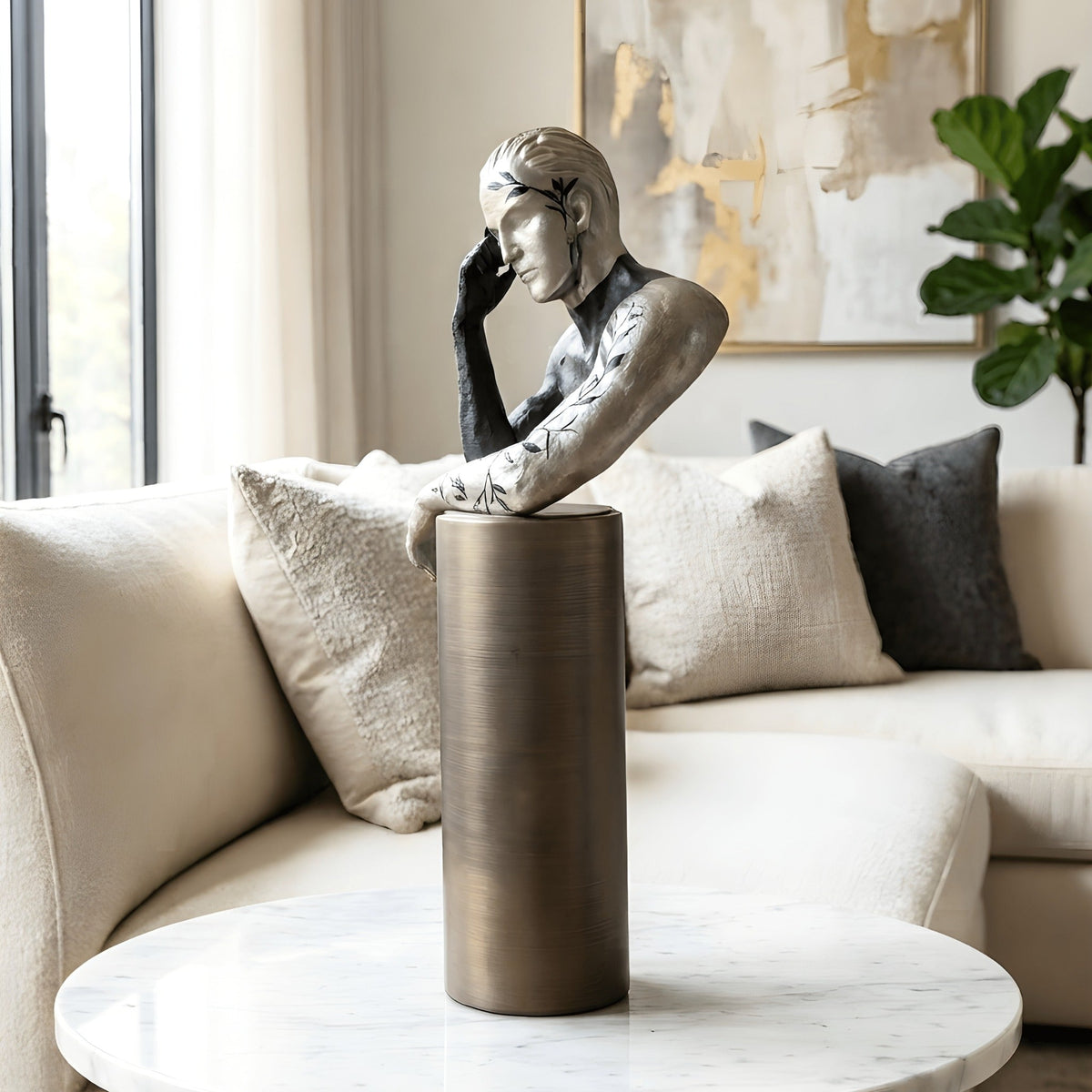 Pensive thinking man showpiece styled as a living room coffee table accent