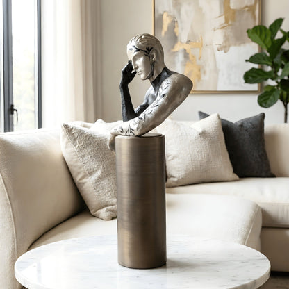 Pensive thinking man showpiece styled as a living room coffee table accent