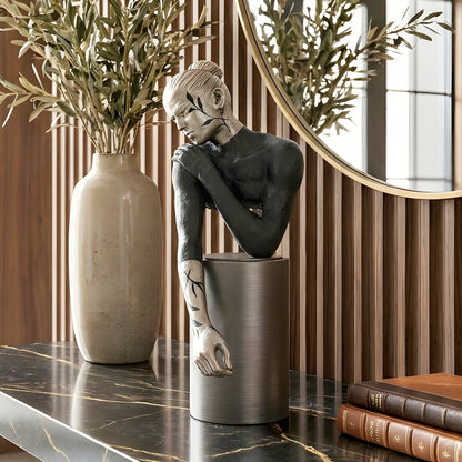 Poise black and silver woman showpiece styled on an entryway console