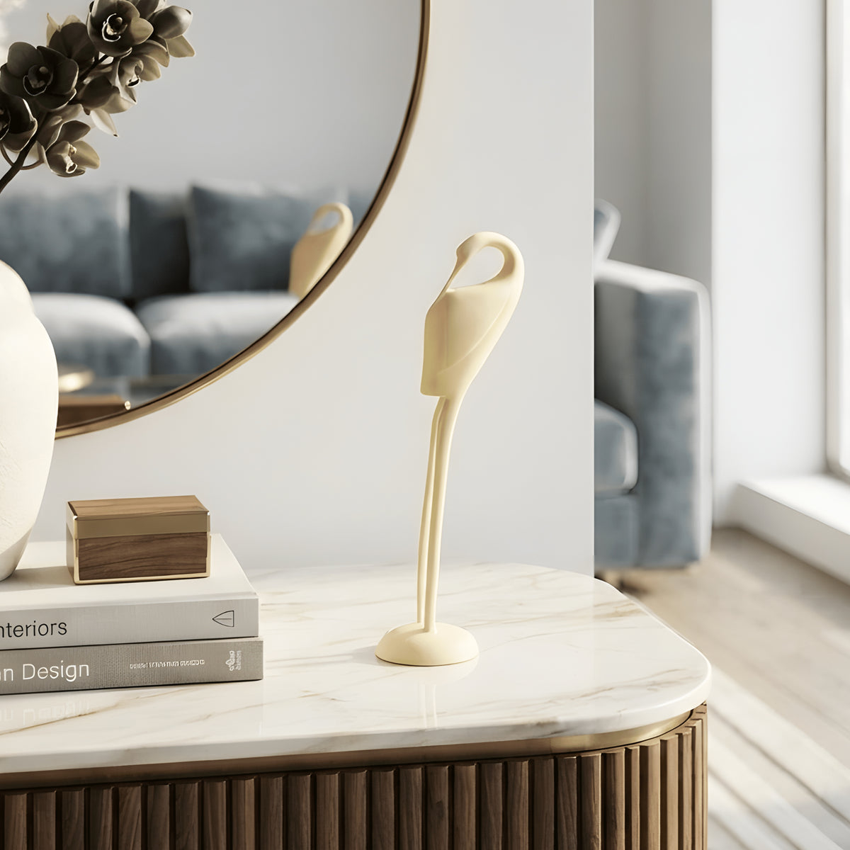 Ivory Poise resin bird sculpture styled on a sideboard for entryway and console table decor