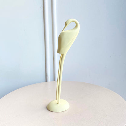 Ivory resin bird figurine with a curved neck and slender legs in the Poise showpiece set