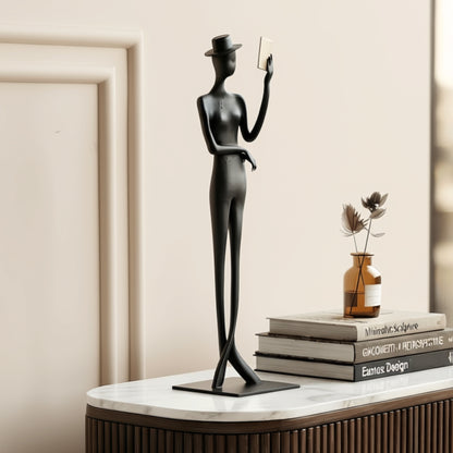 Poise black metal gentleman figurine styled on a marble console