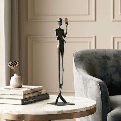 Poise tall metal gentleman showpiece styled on a round marble side table