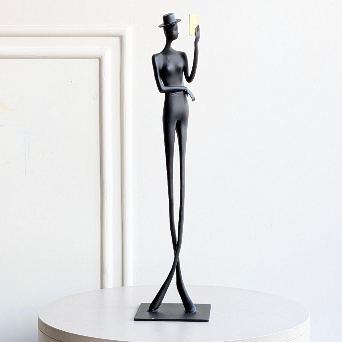 Poise black metal human figurine full front product view