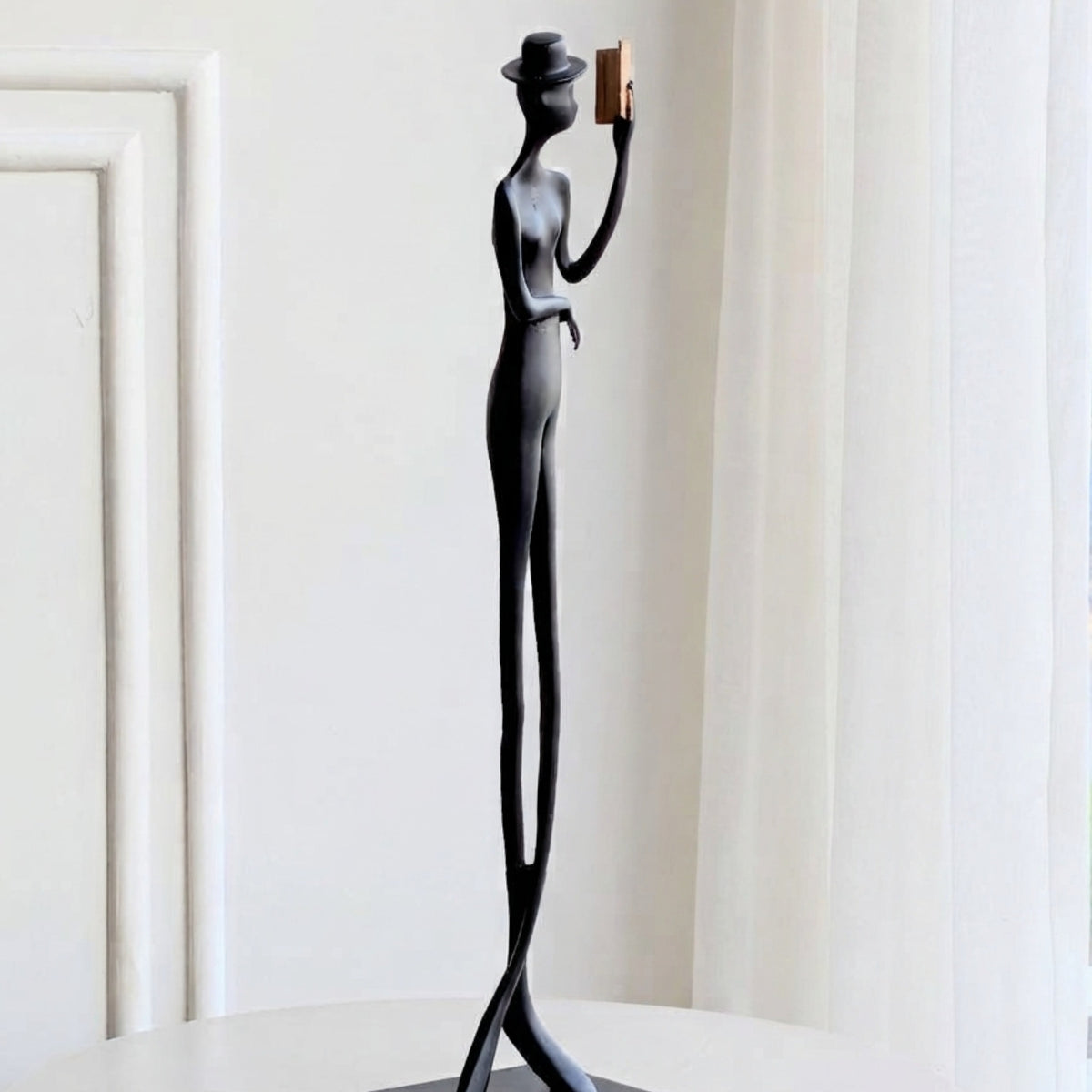Poise tall black metal gentleman figurine side view