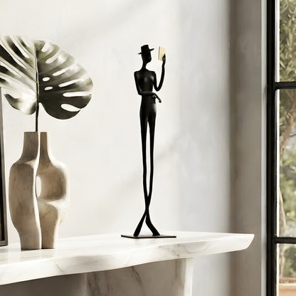 Poise black metal gentleman figurine styled on an entryway console