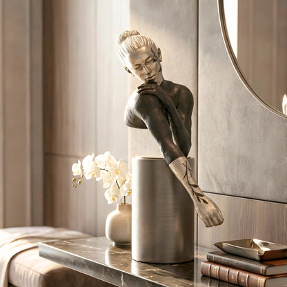 Poise sculptural woman figurine styled on a modern bedroom sideboard