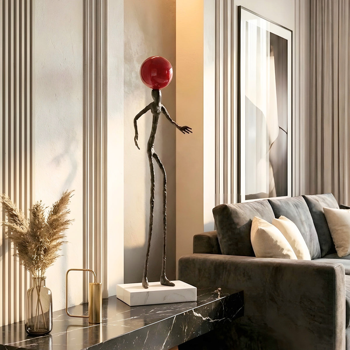 Redshift tall human sculpture styled on a black entryway console