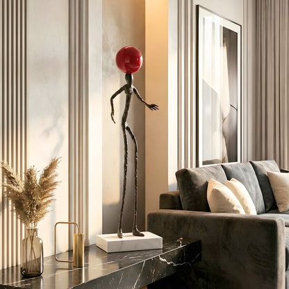 Redshift tall human sculpture styled on a black entryway console