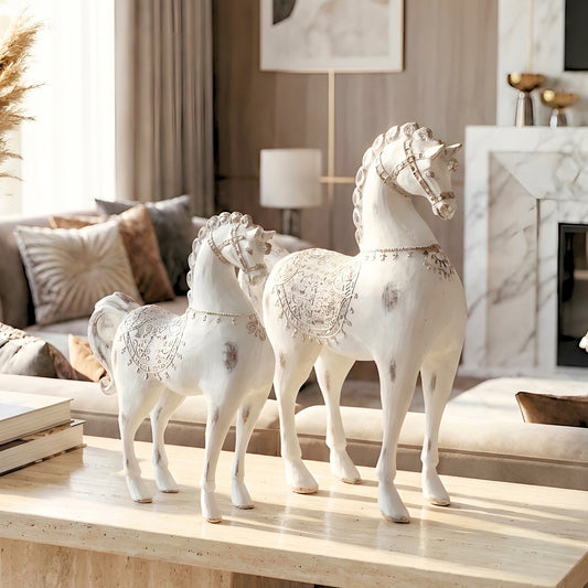 Regalia white resin horse figurines styled on a console table in a modern living room