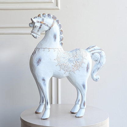 Regalia resin horse figurine profile showing sculpted mane tail and decorative saddle